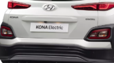 Hyundai Kona Electric - A modern, electric vehicle with a sleek design against a scenic backdrop, showcasing eco-friendly technology and innovation